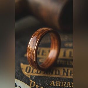 Men’s wood & copper wedding band. Size 7 1/2, non-resizable. Unworn, new in box.